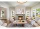 Relaxing living room with a stone fireplace, elegant seating, and lots of natural light at 4004 Nettie Ct # 1, Charlotte, NC 28211
