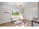 Bright sitting room with hardwood floors, natural light, and cozy decor at 4004 Nettie Ct # 1, Charlotte, NC 28211