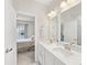 A bathroom with double sinks and vanities leads to a bedroom with a coordinated color scheme at 4010 Citra Ln, Charlotte, NC 28217