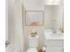 Clean bathroom featuring a shower with curtain, modern fixtures, and a neatly decorated vanity at 4010 Citra Ln, Charlotte, NC 28217