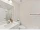 Clean bathroom with a frameless glass shower, modern fixtures, and a neutral color palette at 4010 Citra Ln, Charlotte, NC 28217