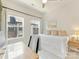 Bright bedroom featuring two windows, a daybed with built-in storage, and a cozy study area at 4010 Citra Ln, Charlotte, NC 28217