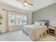 Inviting bedroom featuring a large bed, neutral tones, and a window providing natural light at 4010 Citra Ln, Charlotte, NC 28217