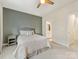 A primary bedroom with an ensuite bathroom is shown, featuring neutral decor and comfortable furniture at 4010 Citra Ln, Charlotte, NC 28217