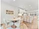 Cozy dining area featuring stylish chairs, hardwood floors, and bright lighting next to the kitchen at 4010 Citra Ln, Charlotte, NC 28217