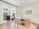 Bright dining area with modern round table, stylish chairs, and sliding glass doors to a patio at 4010 Citra Ln, Charlotte, NC 28217
