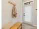 Inviting entryway with coat rack, bench seating, and a door leading to the outside at 4010 Citra Ln, Charlotte, NC 28217