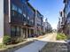 Attractive townhomes featuring a mix of brick and siding with well-maintained landscaping at 4010 Citra Ln, Charlotte, NC 28217