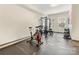 Home gym featuring workout equipment, weights, and natural light from large windows at 4010 Citra Ln, Charlotte, NC 28217