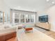 Bright living room featuring a modern sofa, large windows, and stylish decor at 4010 Citra Ln, Charlotte, NC 28217