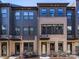 Beautiful townhomes with brick facades, dark trim, and manicured front yards at 4010 Citra Ln, Charlotte, NC 28217