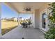 Relaxing covered patio features a ceiling fan and ample space for outdoor seating at 4023 Vista Pine Dr, Charlotte, NC 28215