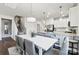 Bright dining area connects seamlessly with a modern kitchen and the stairs to the second floor at 4023 Vista Pine Dr, Charlotte, NC 28215