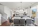Open concept dining area view to the modern kitchen with an island and ample counter space at 4023 Vista Pine Dr, Charlotte, NC 28215