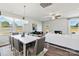 Bright dining area with a modern chandelier and large windows that give natural light at 4023 Vista Pine Dr, Charlotte, NC 28215