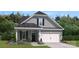 Charming new construction with a welcoming facade and a two-car garage at 4023 Vista Pine Dr, Charlotte, NC 28215