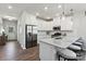 Modern kitchen featuring stainless steel appliances, granite countertops, and a breakfast bar at 4023 Vista Pine Dr, Charlotte, NC 28215