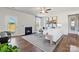 Cozy living room with a fireplace, ceiling fan, and access to the backyard at 4023 Vista Pine Dr, Charlotte, NC 28215