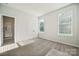Cozy bedroom with double closets, large windows, and ensuite bathroom access at 4027 Vista Pine Dr, Charlotte, NC 28215
