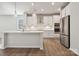 Modern kitchen with island, stainless appliances and hardwood floors at 4027 Vista Pine Dr, Charlotte, NC 28215