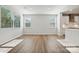 Bright living room featuring hardwood floors, large windows and a view of the kitchen at 4027 Vista Pine Dr, Charlotte, NC 28215