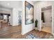 Inviting entryway with hardwood floors, elegant decor, and a view of the living room and bathroom at 4035 Vista Pine Dr, Charlotte, NC 28215