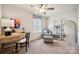 Bright office with a ceiling fan, desk, chair and shelving unit at 4035 Vista Pine Dr, Charlotte, NC 28215