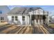 The rear of the house features a screened-in porch and a well-maintained yard at 4035 Vista Pine Dr, Charlotte, NC 28215