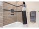 Elegant bathroom with modern bathtub, tiled walls and stylish fixtures at 404 N Laurel Ave # 18, Charlotte, NC 28204