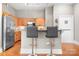 Spacious kitchen area with stainless steel appliances, granite countertops, and breakfast bar offering ample seating at 404 N Laurel Ave # 18, Charlotte, NC 28204