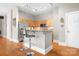 Open concept kitchen with stainless steel appliances, granite countertops, and breakfast bar offers ample counter space at 404 N Laurel Ave # 18, Charlotte, NC 28204