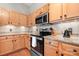 Well-equipped kitchen featuring granite countertops, stainless steel appliances, and modern tile backsplash at 404 N Laurel Ave # 18, Charlotte, NC 28204