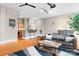 Contemporary living room boasts hardwood floors, modern lighting, and open layout to the kitchen and dining area at 404 N Laurel Ave # 18, Charlotte, NC 28204