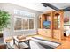 Living room with entertainment center, hardwood floors, and large window providing ample natural light at 404 N Laurel Ave # 18, Charlotte, NC 28204