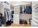 Organized walk-in closet with shelving, drawers, and ample storage space at 404 N Laurel Ave # 18, Charlotte, NC 28204
