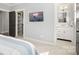 Bedroom showcasing closet, TV, and bathroom access for added convenience in a naturally-lit home at 448 Iverson Way, Charlotte, NC 28203