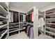 Spacious walk-in closet with custom shelving for optimal storage and organization in a well-lit area at 448 Iverson Way, Charlotte, NC 28203