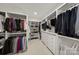 Walk-in closet with custom shelving, hanging rods, and built-in drawers at 448 Iverson Way, Charlotte, NC 28203