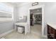 Dressing area featuring a makeup vanity and a walk-in closet with custom shelving at 448 Iverson Way, Charlotte, NC 28203
