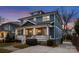 This stunning two-story home features a welcoming front porch and a well-manicured yard at 448 Iverson Way, Charlotte, NC 28203