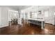 Open-concept kitchen featuring a large island, modern appliances, and hardwood floors with adjoining dining at 448 Iverson Way, Charlotte, NC 28203