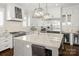 Modern kitchen featuring an island with seating, high-end appliances, and stylish cabinetry at 448 Iverson Way, Charlotte, NC 28203