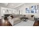 Open-concept living room with seamless access to a modern kitchen at 448 Iverson Way, Charlotte, NC 28203