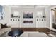 Cozy living room with fireplace, built-ins, and hardwood floors at 448 Iverson Way, Charlotte, NC 28203