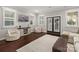 Inviting living room with plush beanbag chairs, a neutral rug, and bright natural light at 448 Iverson Way, Charlotte, NC 28203