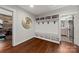 Well-organized mudroom featuring built-in storage, seating, and coat hooks for convenience at 448 Iverson Way, Charlotte, NC 28203