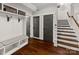 Convenient mudroom with built-in bench, coat hooks, and storage cabinets, creating an organized entryway at 448 Iverson Way, Charlotte, NC 28203