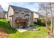 A shot of the backyard featuring a deck, patio area, fire pit and green lawn at 6458 Chadwell Ct # 30, Indian Land, SC 29707