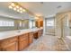 Large bathroom with double vanities, a big mirror, tile flooring, and a glass-enclosed shower at 6458 Chadwell Ct # 30, Indian Land, SC 29707