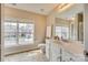 Neutral colored bathroom with a large window above the toilet and vanity area at 6458 Chadwell Ct # 30, Indian Land, SC 29707